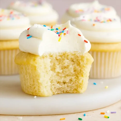 Vanilla cupcakes with swirled buttercream and sprinkles